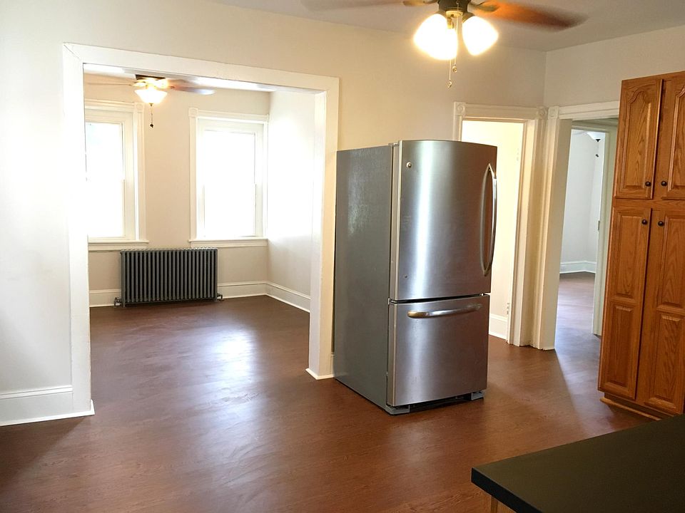 Kitchen flows into living room.