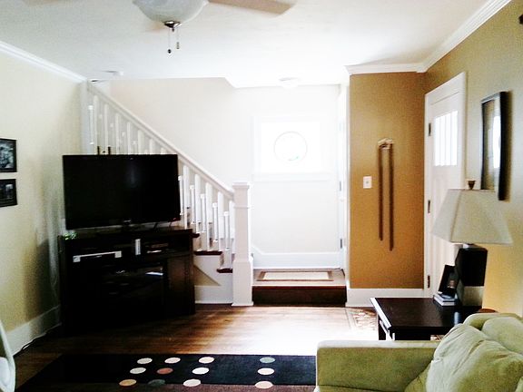 Newly refinished wood floors, open staircase upstairs