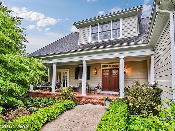 Beautiful covered brick  porch w/columns