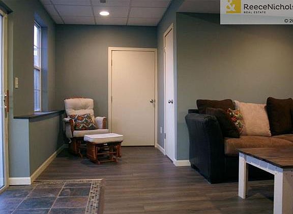 Tiled entry with beautiful stone accents flows into your Family Room