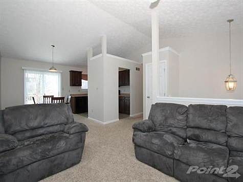 Main level offers cathedral ceiling and open floor plan.
