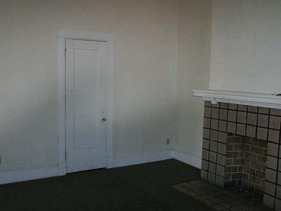 Living room view of fireplace and closet
