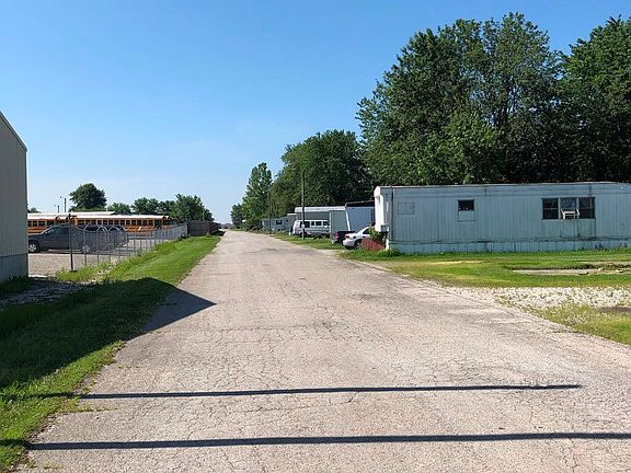View from the main entrance looking east.  Road in decent shape with a few potholes that will need t