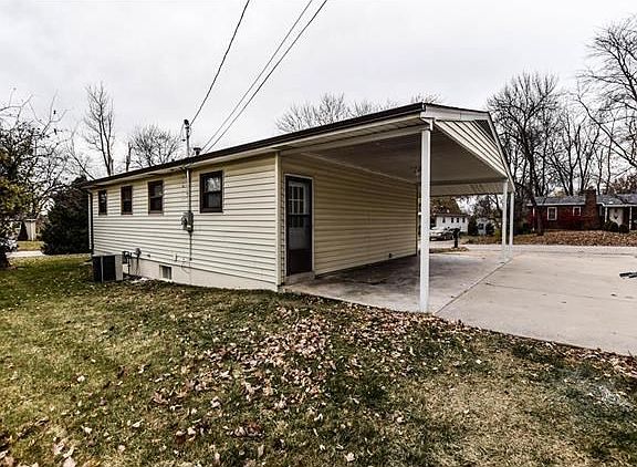 Covered carport and extra driveway space for extra cars, boats, etc.