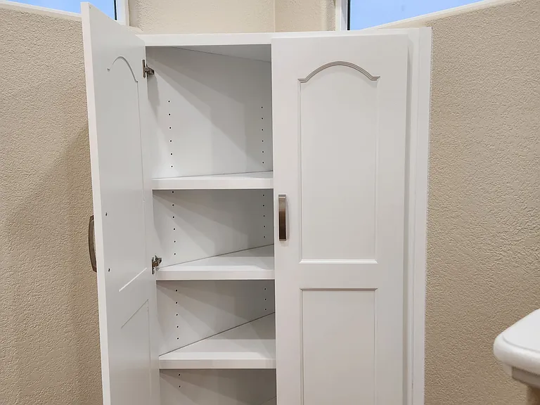 Linen closet above stairs. Notice plenty of natural light throughout home.