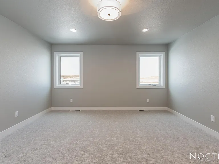 Bonus room off the stairs. (Photo of another unit with similar finishes and quality.)