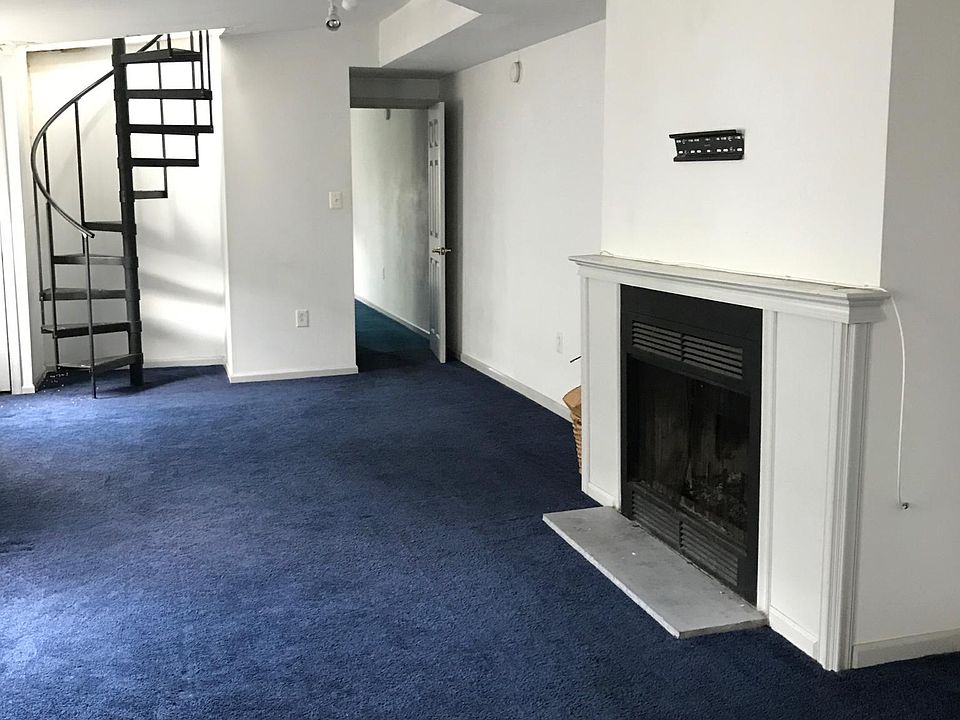 Living room - functional fire place and spiral staircase to private roof deck