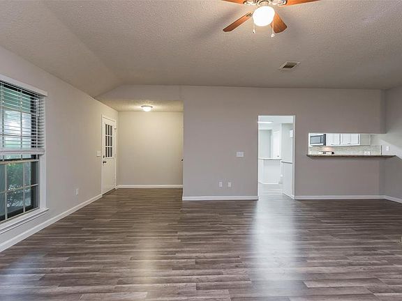 Welcome home! Boasting beautiful hard floors throughout the living spaces, several large windows - all with privacy blinds, high ceilings, a ceiling fan, and more! This home is absolutely perfect for entertaining friends and family.