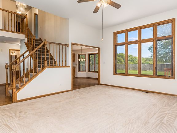 Vaulted Ceilings, Open Staircase and Chandelier!