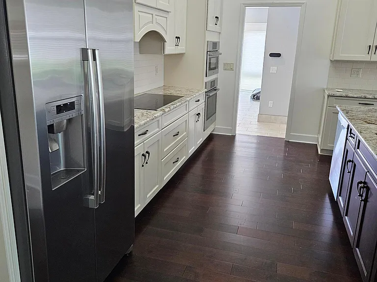 Bosch stainless refrigerator with water and ice maker.