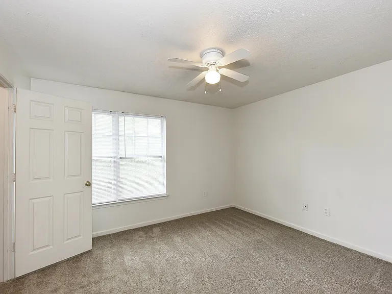 Bedroom with carpet & ceiling fan