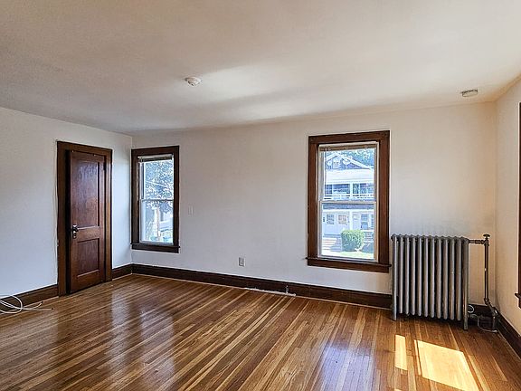 Living Room - Living room featuring closet space, plenty of natural light, and hardwood floors.