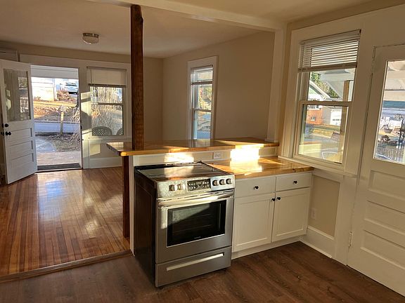 View from kitchen through living room to front door.