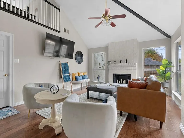 Designer living room with plenty of seating. All windows have dark out ultimate closure blinds.