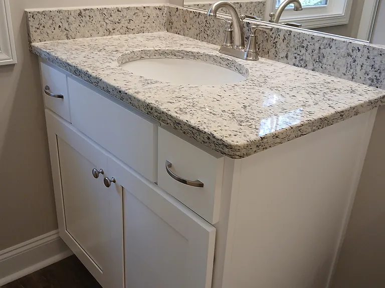 Granite vanity and a window for natural light!