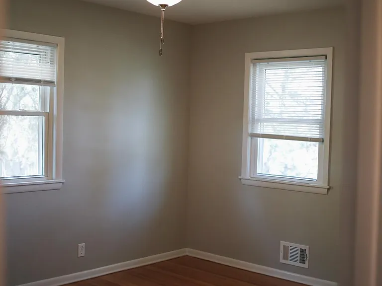 Large master bedroom with refinished hardwood floors, original to the house. Easily fits a king size bed.