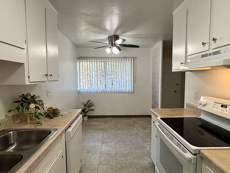 Unit 210B:
View of Bright Dining Area from Kitchen