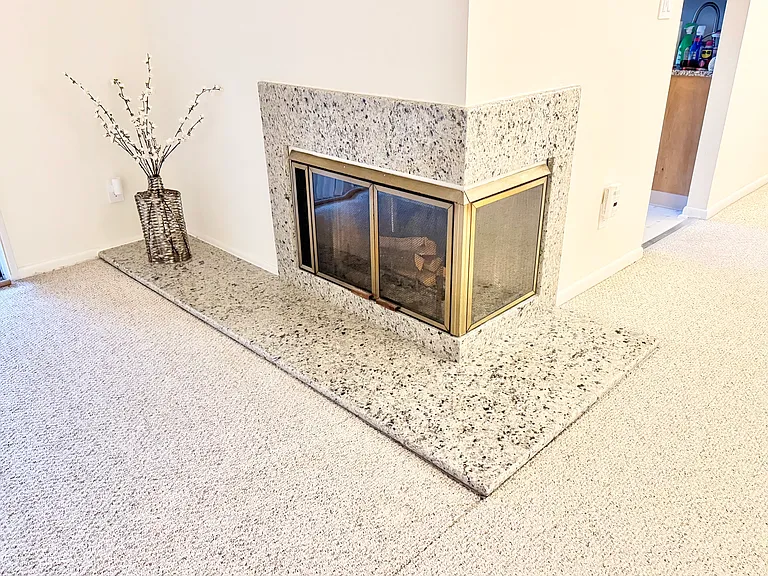Stunning Italian marble fireplace is centerpiece for living area
