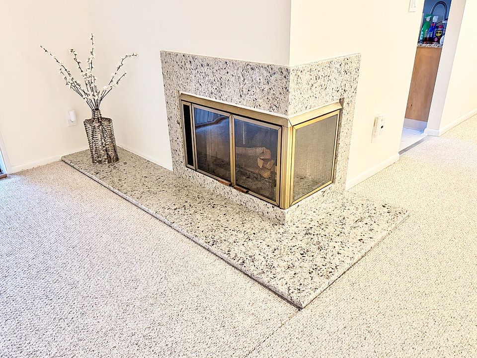 Stunning Italian marble fireplace is centerpiece for living area