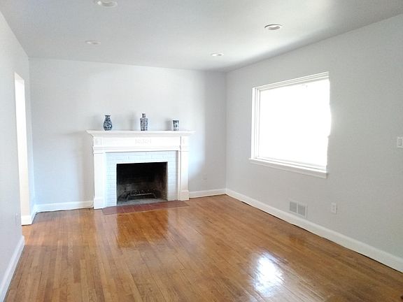 Living room with fire place & picture window.