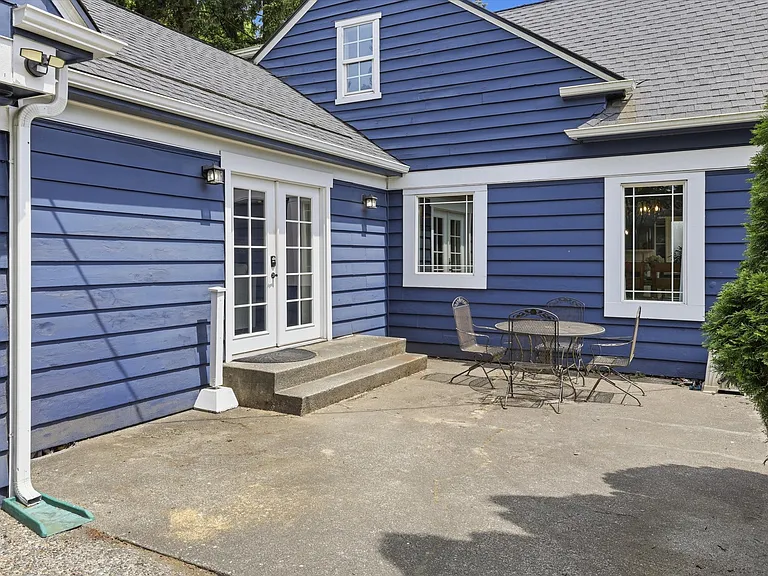 Front of house off of driveway.