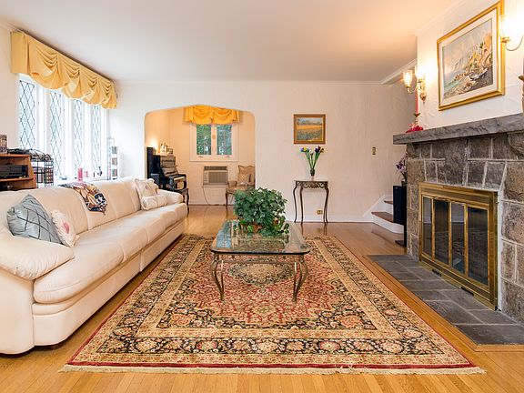Spacious Living Room with Dramatic Stone Fireplace