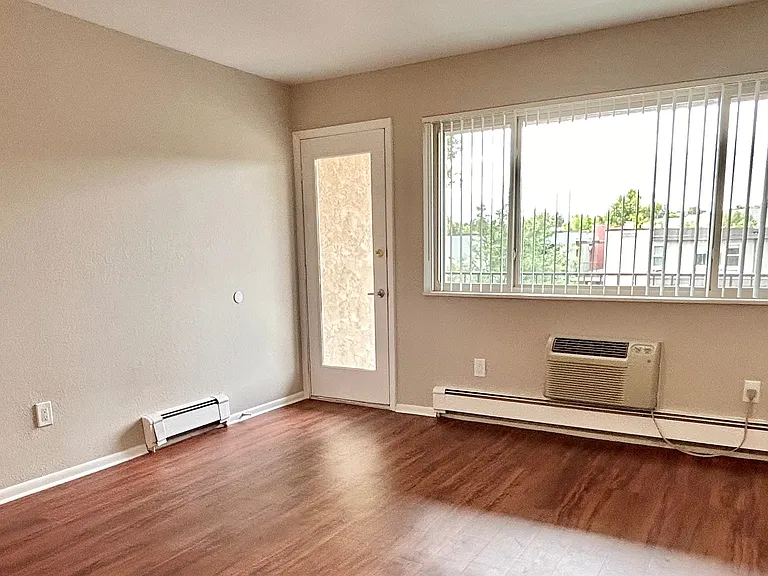 Experience the warmth of this bright, open living area featuring expansive windows. Experience the warmth of this bright, open living area featuring expansive windows.
