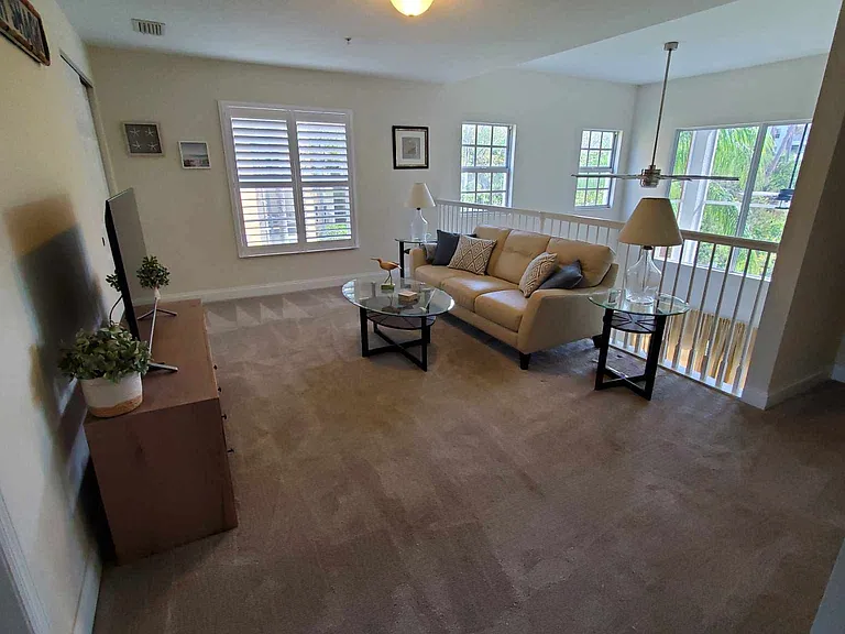2nd floor loft used as family room with TV