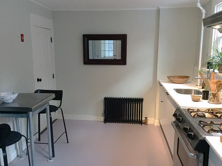 Kitchen with door to basement laundry