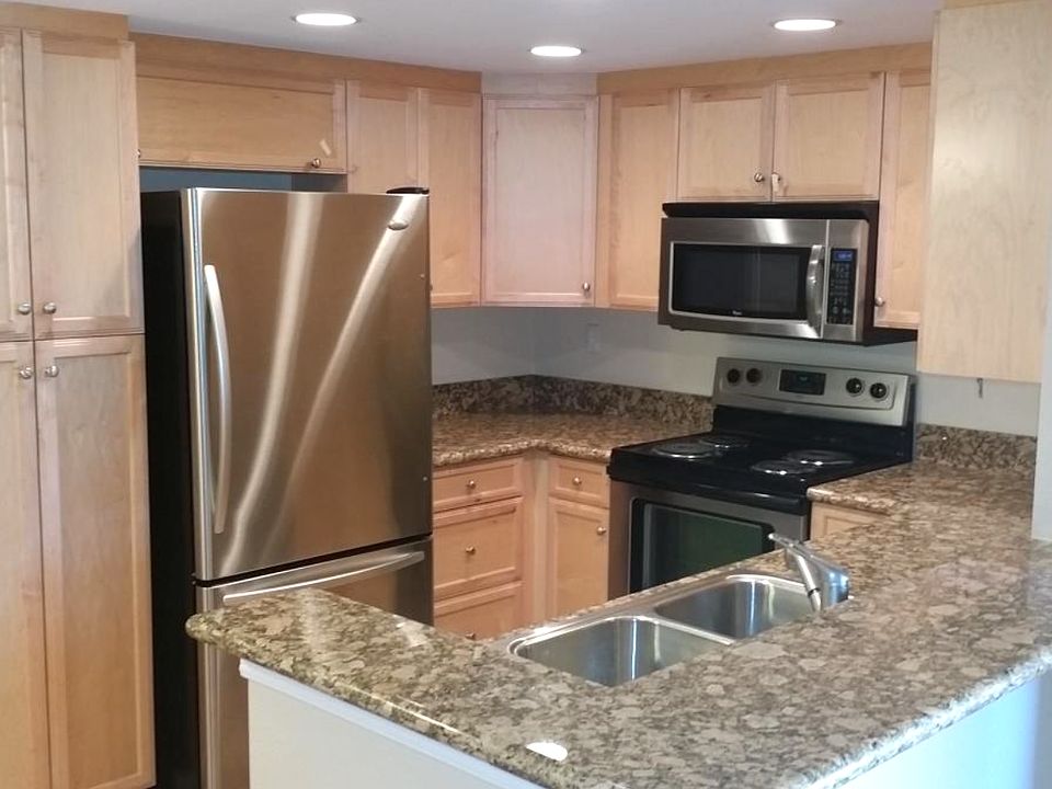 Kitchen with Stainless Steel Appliances and Designer Granite