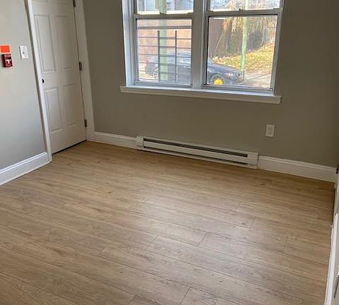 Back bedroom with exit door