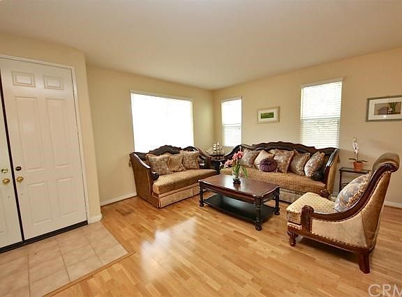 Enter through double doors into this lovely formal living room.
