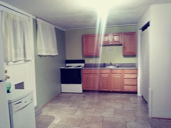 Kitchen door leading to fenced back yard
