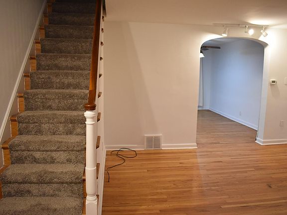Living room, steps to upstairs