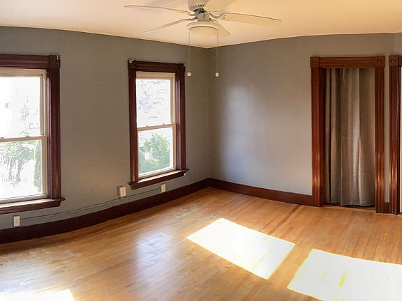 Large living room overlooking driveway.
