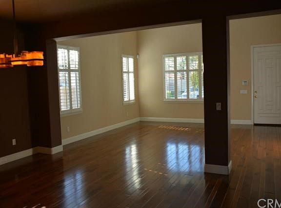 View from dining room to living room and front entry