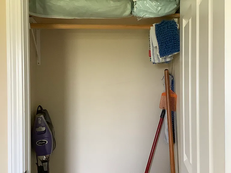 Bedroom closet with extra blankets.