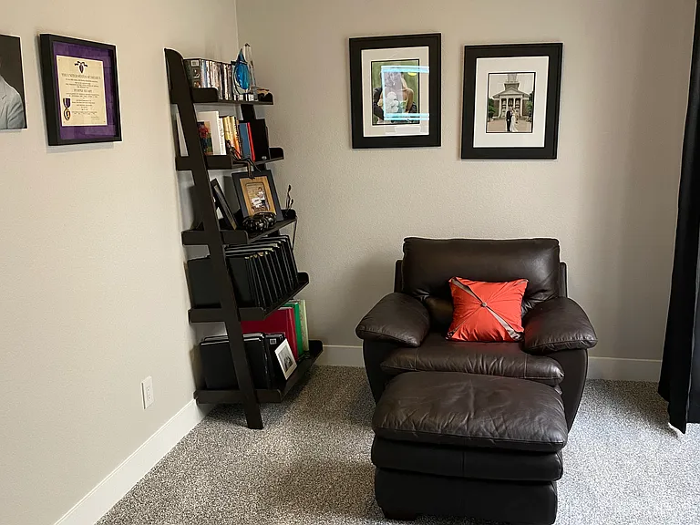 Sitting room adjoins master suite which has wall mounted smart tv.