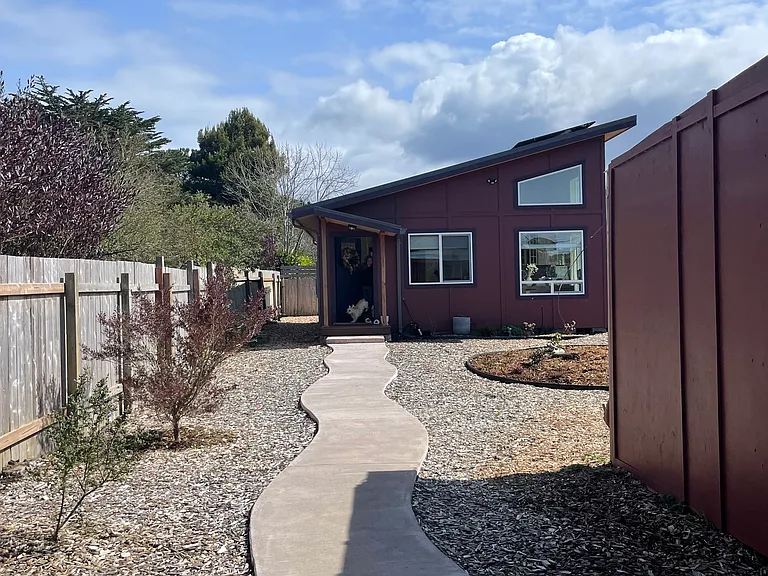 The entrance to the home. Part of the shed on the right is storage for the home.