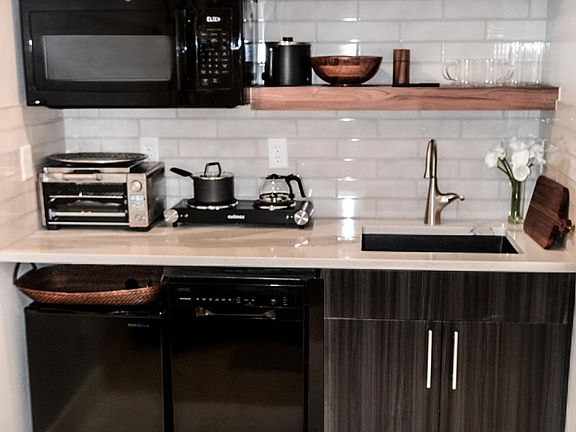 This apartment is turnkey. Bring nothing but yourself. Cabinets loaded with everything you need.