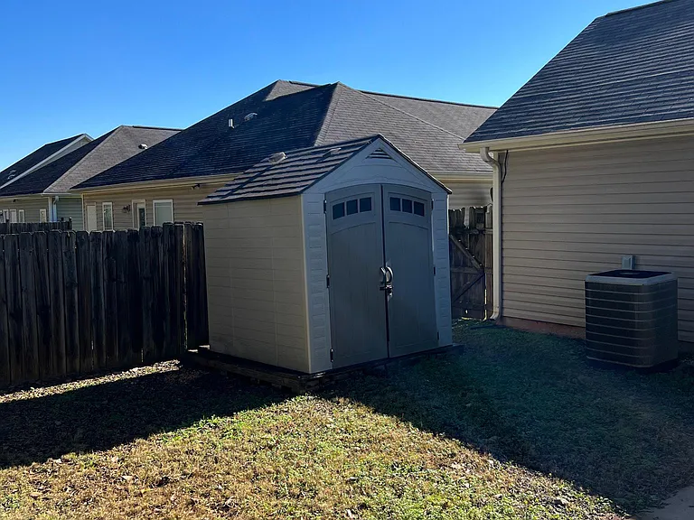 Large storage shed in backyard.