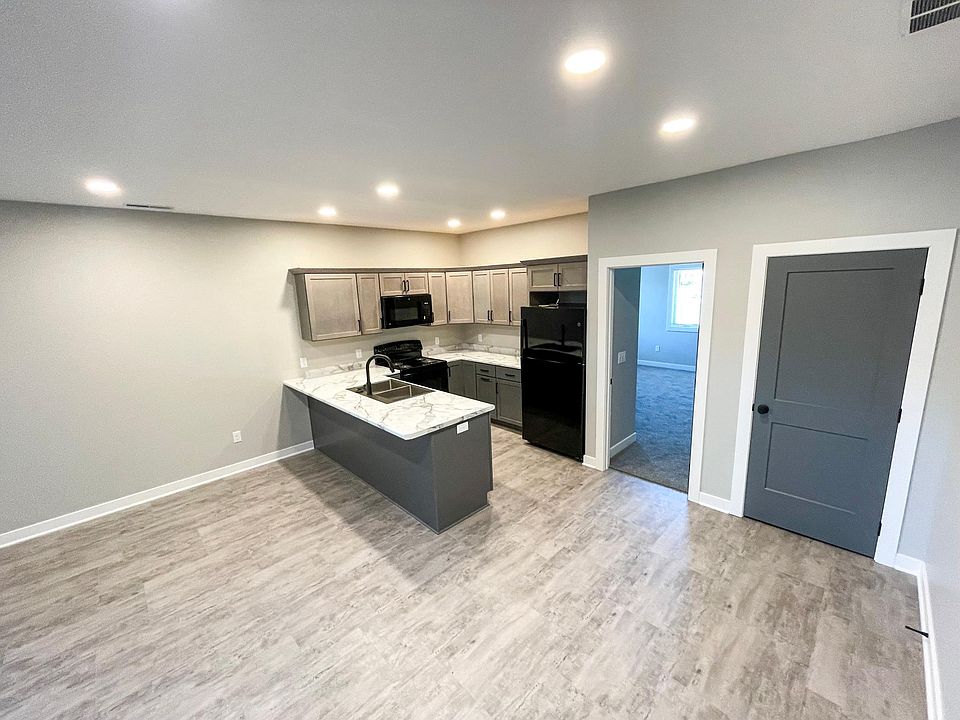 Entrance into open kitchen and living space.