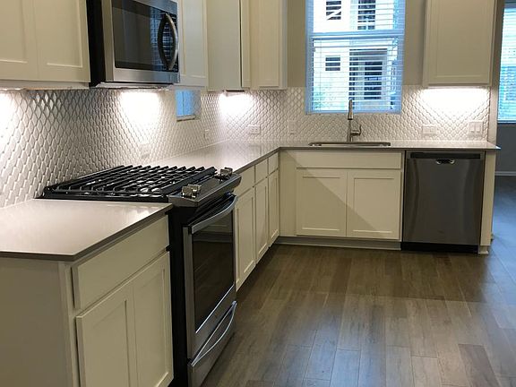 Kitchen with new stainless steel appliances
