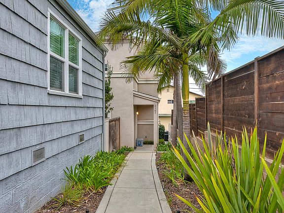 Front entrance, follow the path to the right of 2159 Reed.