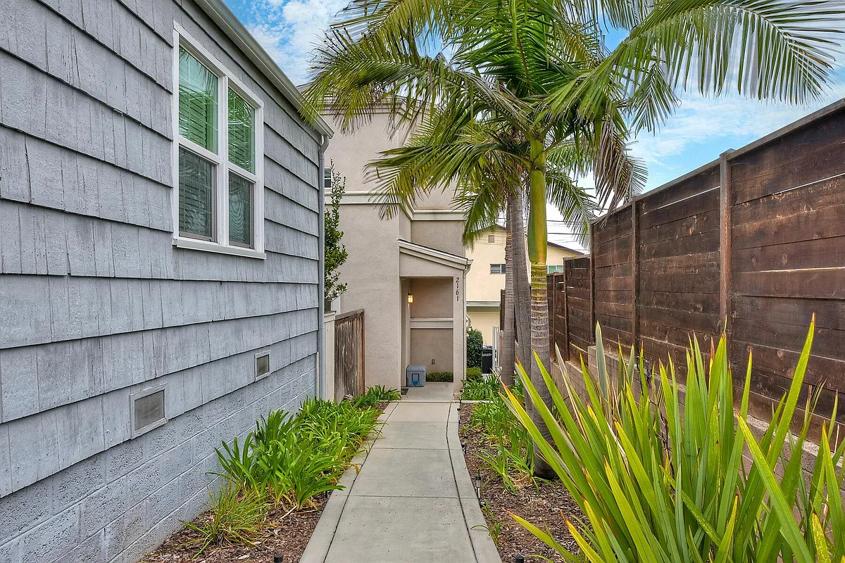 Front entrance, follow the path to the right of 2159 Reed. - 2161 Reed Ave