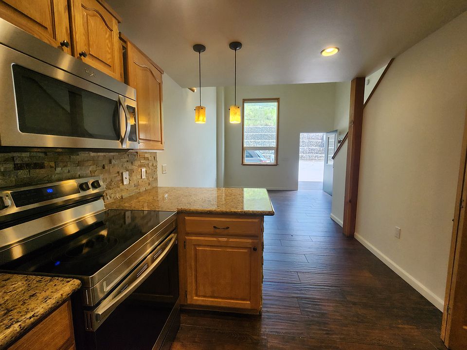 Kitchen looking into living room