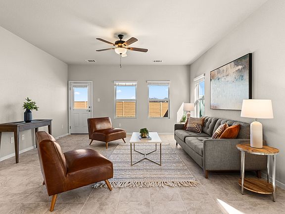 Spacious living area has access to large back yard