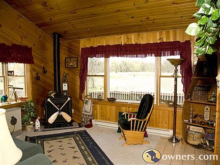 Pine family room with gas fireplace and view