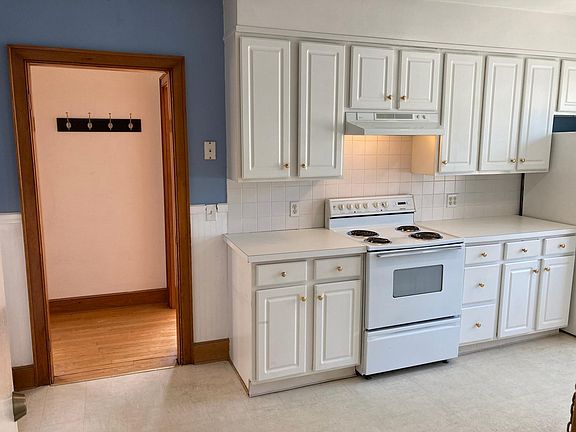 Kitchen and hallway into living room and bedrooms.