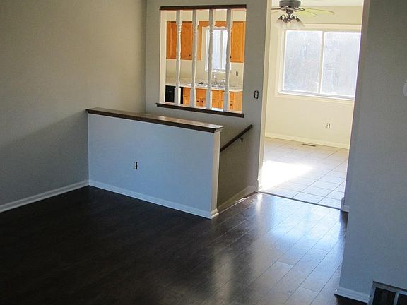 Dark wood and tile through most of the first floor.